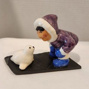 Inuit/Eskimo and baby Seal on slate